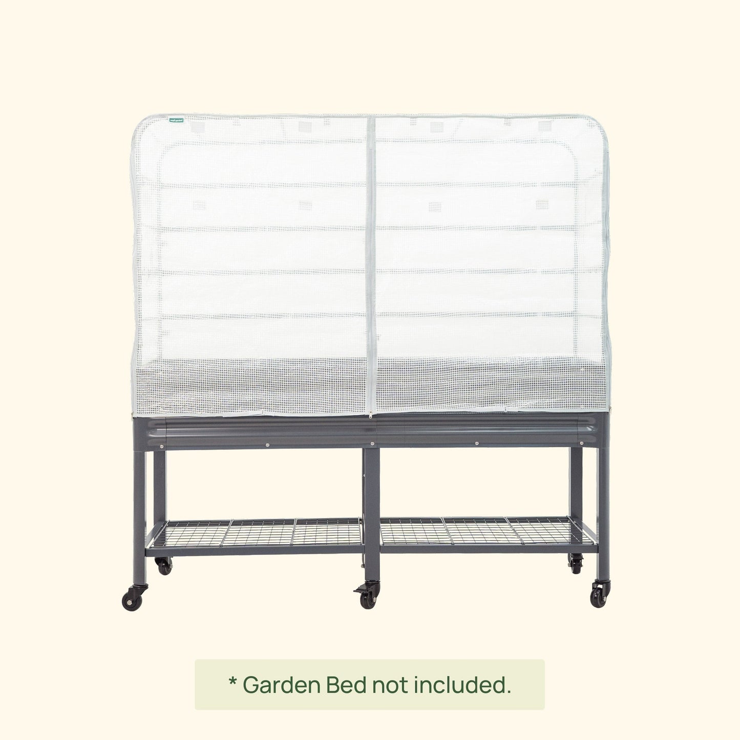 Green frost cover and trellis system installed over an elevated wooden garden bed protecting seedlings