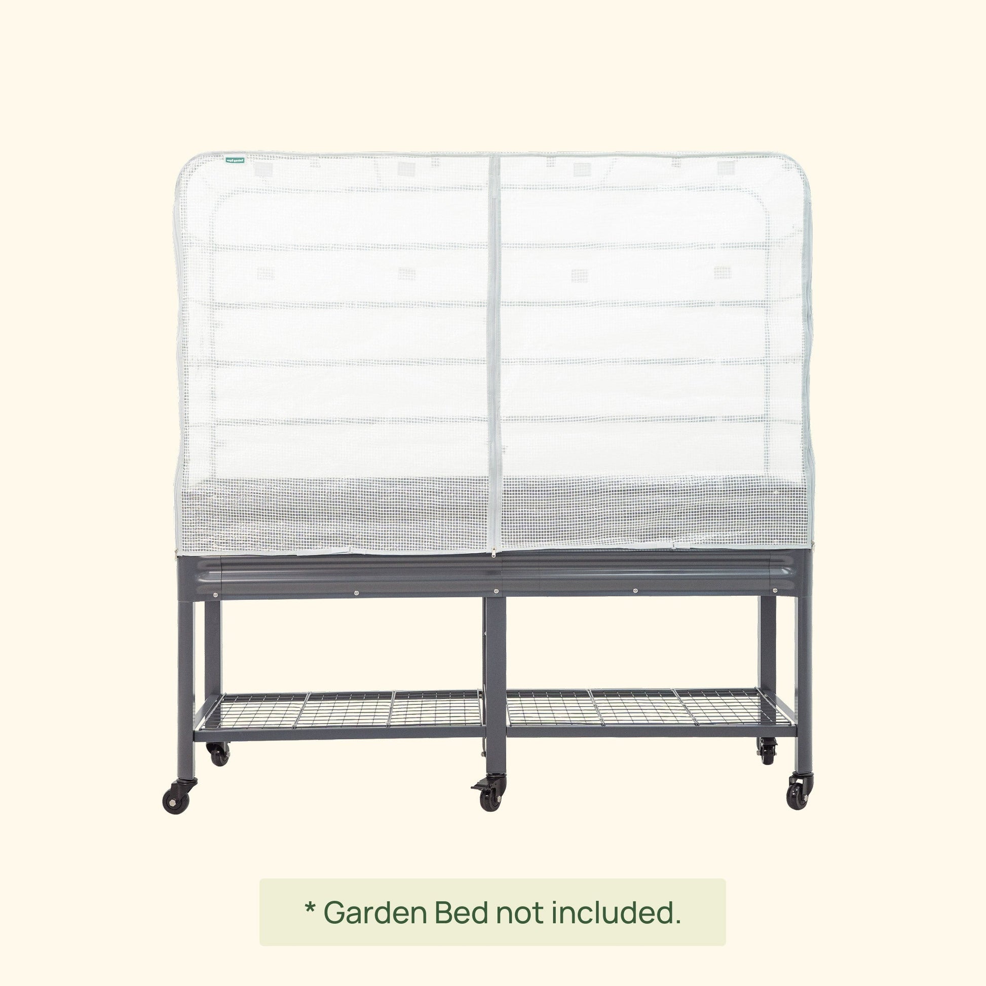 Green frost cover and trellis system installed over an elevated wooden garden bed protecting seedlings