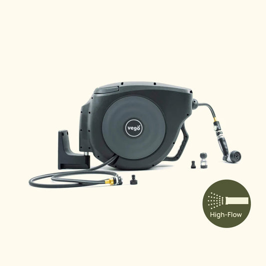 Retractable garden hose reel with 50ft hi-flow hose mounted on wall for easy watering