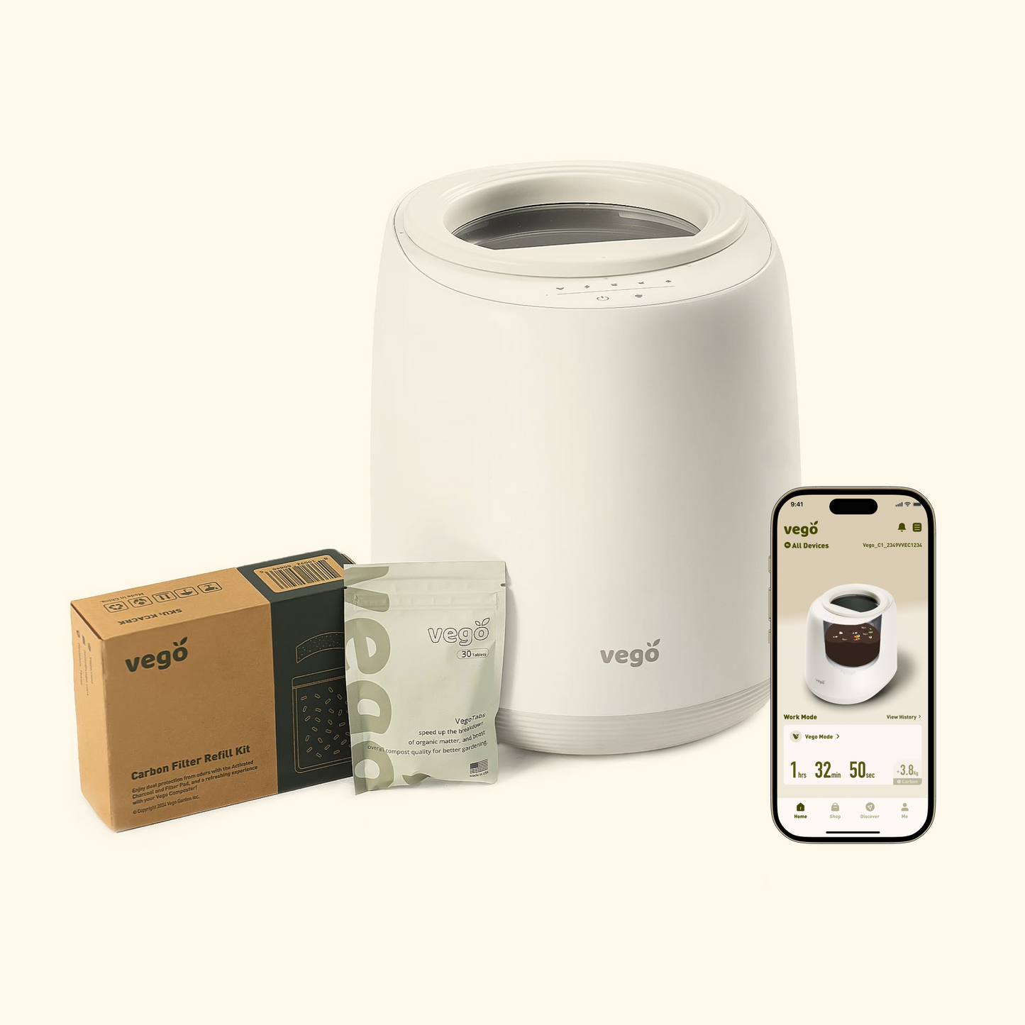 Small stainless steel countertop compost bin with flip lid and charcoal filter, sitting on a kitchen counter next to a cutting board