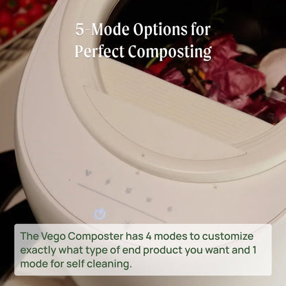 Matte white countertop compost bin with flip lid and charcoal filter, shown on a kitchen counter near a cutting board.