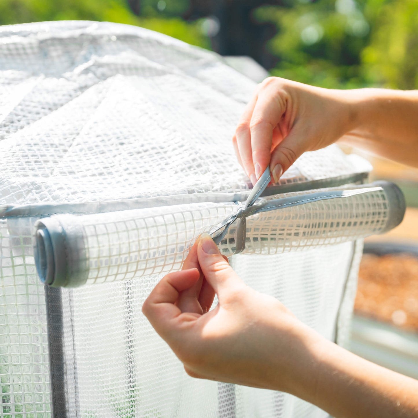 Heavy-duty frost protection cover with built-in trellis supporting climbing plants and insulating against cold