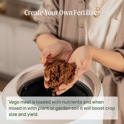 Matte ceramic countertop compost bin with wooden lid and push-button opening, shown on kitchen counter near sink