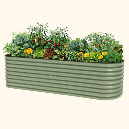 Large modular 26-inch tall metal raised garden bed kit in a backyard with soil and starter plants