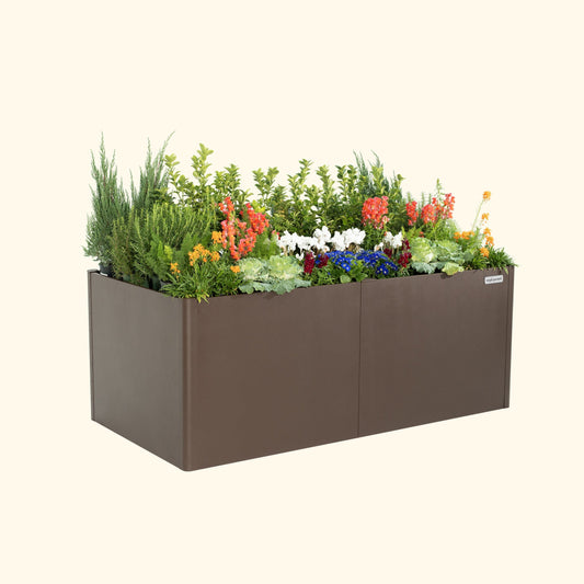 Extra-tall metal raised garden bed with modern rectangular frame and dark finish filled with soil and seedlings