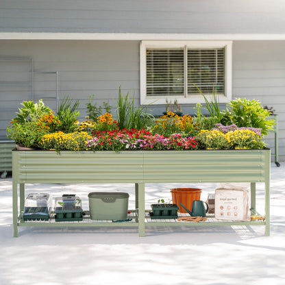 Large elevated wooden garden bed with soil and mixed vegetables on a backyard patio