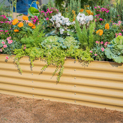 Modular 6-in-1 metal raised garden bed assembled outdoors with lush vegetables and flowers