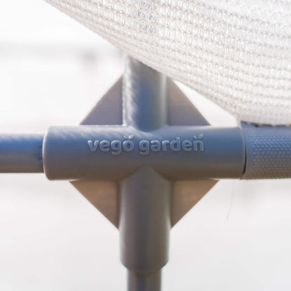 Ventilated mesh cover draped over patio plants, protecting them while allowing airflow and light
