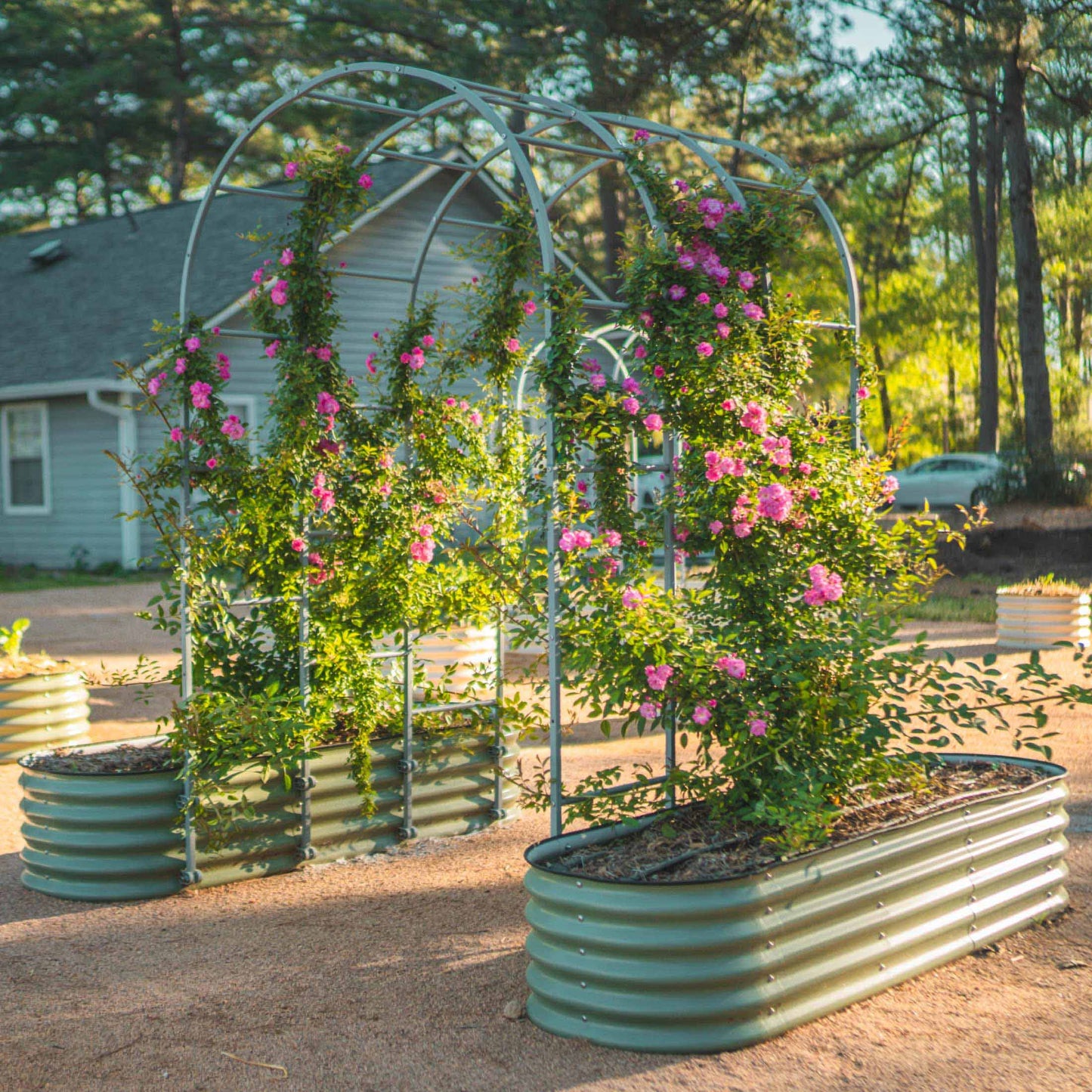 Modular 17" tall metal raised garden bed with corner supports and removable side panels for layered planting