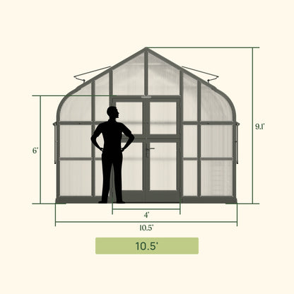 Large Pacific-style greenhouse with glass panels and vented roof sitting on a backyard patio surrounded by plants