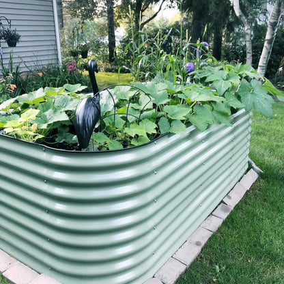 Extra-tall 32-inch modular metal raised garden bed assembled with soil and mixed vegetables in a backyard