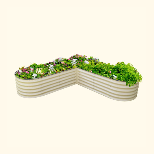 L-shaped 17-inch tall raised garden bed kit in natural wood finish, assembled in a backyard corner with soil