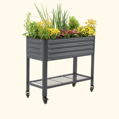 Slim elevated wooden garden bed with slatted sides and soil, ideal for small patios or balconies